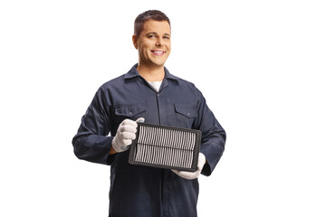 Auto mechanic holding a car air filter