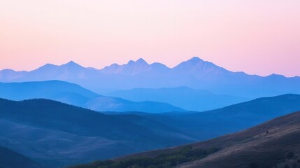 Obraz premium Serene mountain landscape at dusk with soft pastel colors and layered hills.