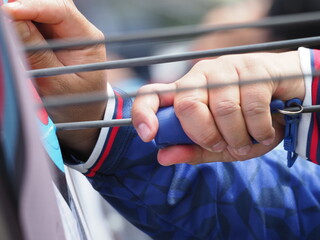 Man pulling the arrow from the target face.