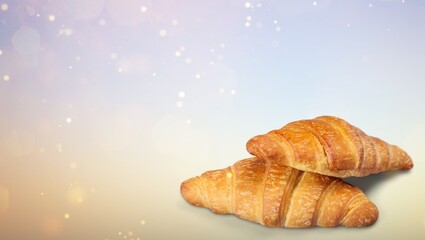 Freshly baked tasty croissant on the desk