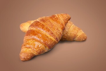 Freshly baked tasty croissant on the desk