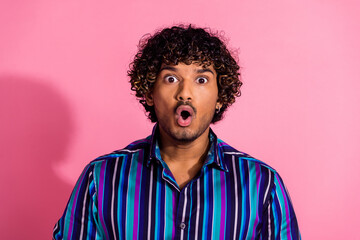 Fototapeta premium Photo of speechless staring man wear trendy striped clothes open mouth isolated on pink color background