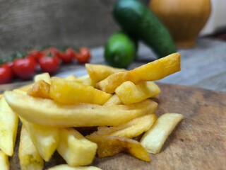 Close-up with French fries and delicious sausage . high quality photos.