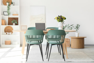 Interior of dining room with table and shelf unit