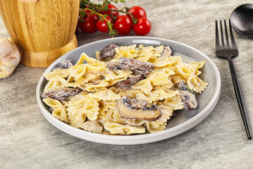 Italian cuisine - farfalle with mushrooms