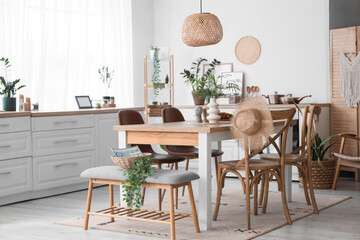 Bench, table and chairs in interior of stylish dining room