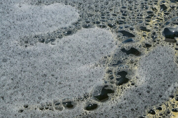 Abstract shapes, patterns and textures of white water foam. Fish pond water foam. For graphic design or banner background