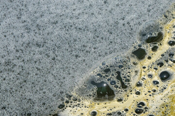 Abstract shapes, patterns and textures of white water foam. Fish pond water foam. For graphic design or banner background