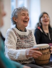 A group of women are gathered in a community center, joyfully participating in a drumming session and laughing together. Music as hobby.