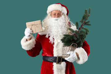 Santa Claus with letters and Christmas tree on green background