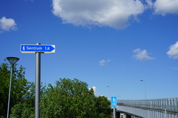 Tromsøya, Romssasuolu, Tromsø Municipality, Troms, Norway - pedestrian street direction sign to Sentrum city centre by crossing Tromsøbrua bridge