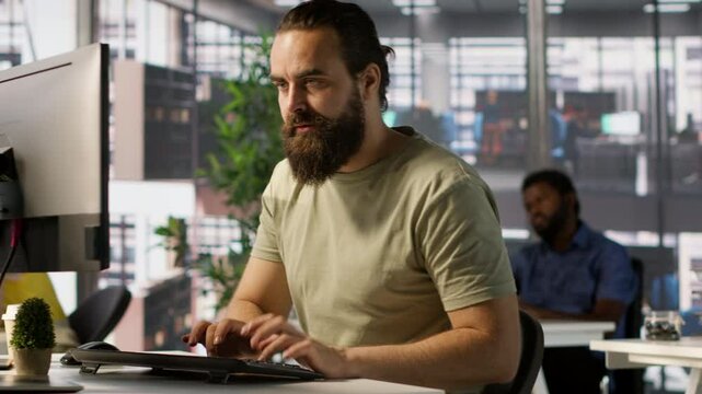 Annoyed programmer at work raging after losing all progress due to computer crash while creating machine learning models. Angry IT worker smashing desk in frustration while programming, camera A