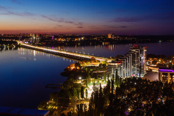 Fototapeta premium Evening Voronezh. Northern bridge over Voronezh river, aerial view