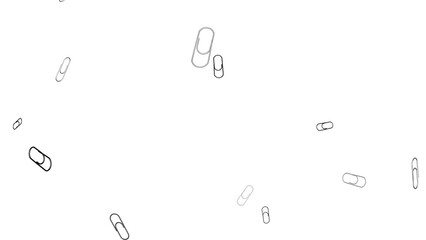 a bunch of paper clips are flying in the air
