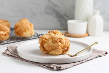 Choux pastry on a white plate. perfect for recipe, article, or any commercial purposes.