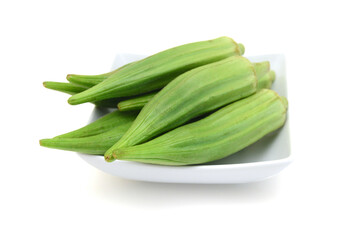 Fresh raw okra isolated on white background, horizontal with copy space