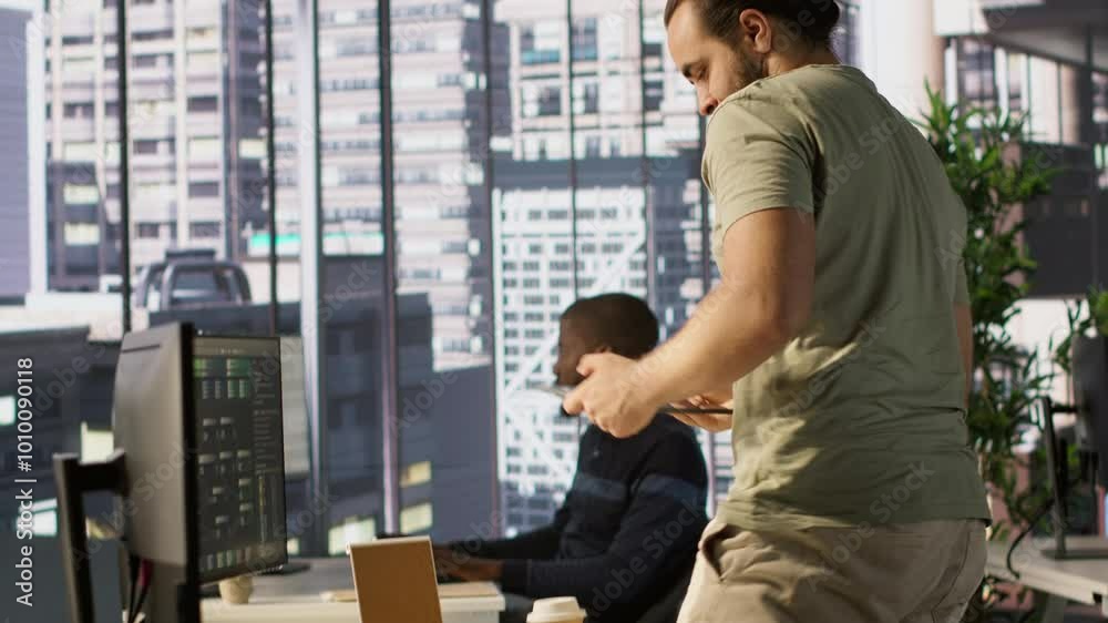 Poster system administrator checking results on tablet after creating complex machine learning models that 