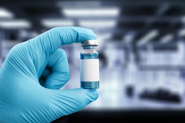 Medical worker filling a syringe with vaccine booster