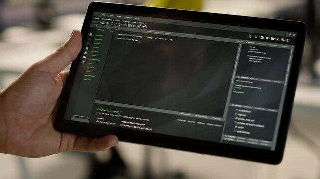 Software engineer using tablet to design algorithms that enable machines to learn from data. Close up of admin in office training and deploying large scale deep learning models with device, camera A