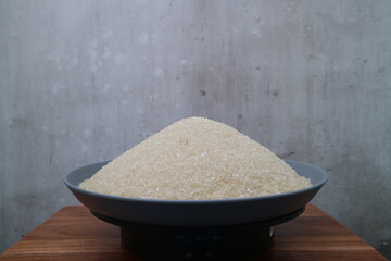 White Sugar (selective focus) on grey background