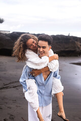 A Couple In Love, Husband And Wife, On The Beach Near The Ocean, Bali.