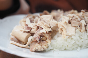 Boiled chicken, steamed rice, pink plate.