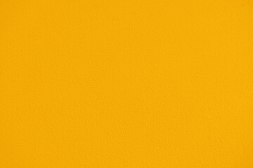 Yellow orange paint concrete wall texture background. Grunge and rough wall. Vintage style of yellow wall texture.
