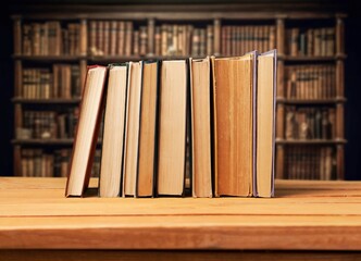 Set of reading books on table in library, education