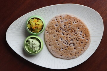 Ragi Set Dosa, Songy soft pancake, , dosa made with fermented batter of finger millet, rice and lentils, south Indian food served with coconut chutney and pototo curry (aloo masala)
