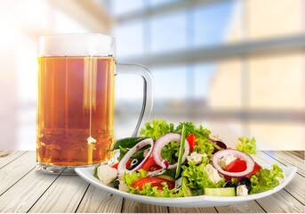 Caesar Salad with fresh vegetables and dressing.