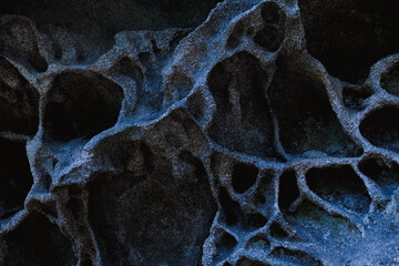 Marble blue background. Dark blue porcelain tiles. Stone slab texture. Ceramic tiles for floor finishing. Graphic abstract background. Ceramic countertop, Bubble stone texture.