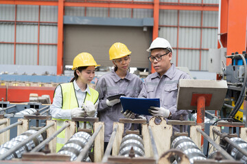 Asian male and female factory worker work training for conveyor at production line in industry...