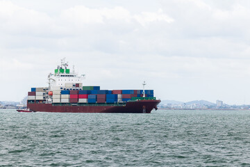 Fototapeta premium cargo container ship sailing inport export of international transportation asia pacific and worldwide, shipping business and industry delivery service by container ship