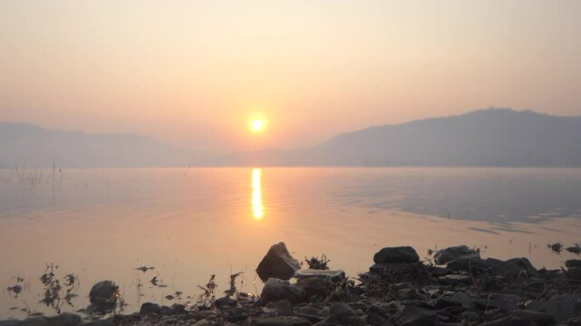 Mountains and sunrise Lam Ta Phoen Reservoir in Thailand