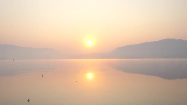 Mountains and sunrise Lam Ta Phoen Reservoir in Thailand