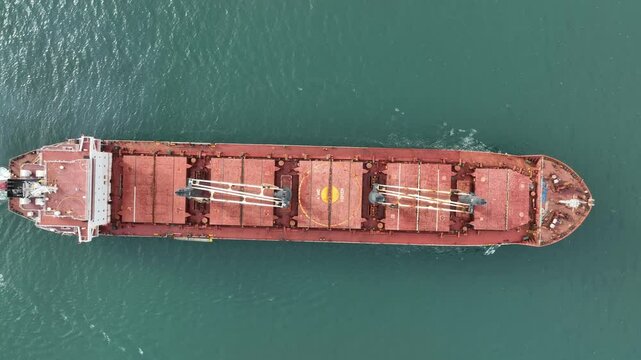 Aerial view of dry cargo ship. Bulk carrier cargo vessel. Ship logistic and transportation business industry.