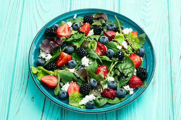 Berries salad (blueberry strawberry blackberry ) with cheese feta and balsamic sauce
