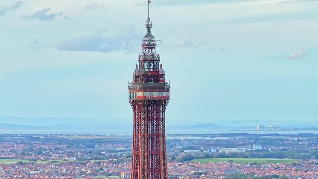 Drone footage of the famous Blackpool Tower with blue sky on a beautiful summer day in one of the UK's most popular holiday destinations
