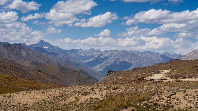 Scenic summer landscape view of high-altitude Deosai Plains with Nanga Parbat in clouds, Astore, Gilgit-Baltistan, Pakistan