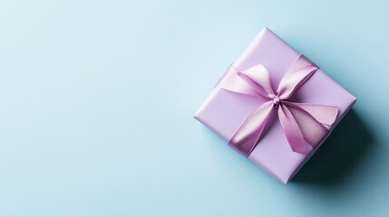 Elegant Gift Box with Soft Lavender Bow on Light Blue Background