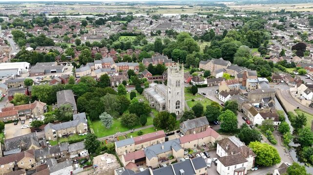 Pull back drone aerial reverse reveal Saint Neots Parish Church Uk,