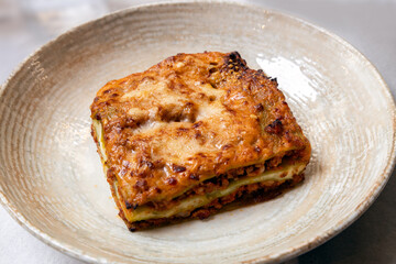 A traditional lasagna Bolognese served at a restaurant in Bologna, Italy