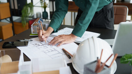 Architecture Man drawing on architectural Creative project business architecture building construction&nbsp;Industrial engineering Achievement Planning Design on eco blueprint