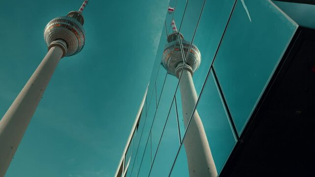BERLIN, GERMANY. Berlin TV Tower. Reflection in glass building of television tower and blue sky. High quality 4k footage. 