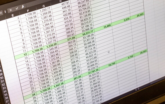 Shot of an dark mode excel sheet on computer screen showing bank loan amortization table. Banking