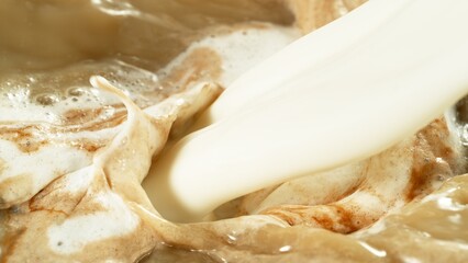 Freeze Motion Detail Shot of Coffee Foam Swirling , Top Down View .