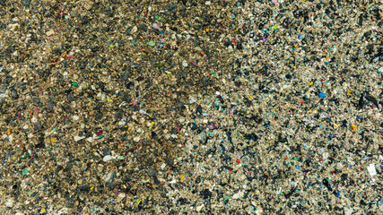 Top view trash, plastic cups and plastic bags at the beach. environmental problem concept and healing the world
