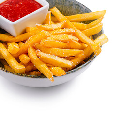 Bowl of french fries with ketchup on white background