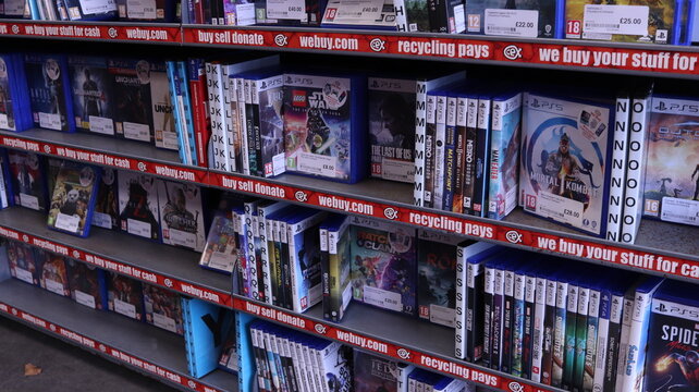 PONTYPRIDD, MID GLAMORGAN, WALES, UK - SEPTEMBER 30, 2024: CEX VIDEO GAMES ON DISPLAY SHELVES PLAYSTATION XBOX