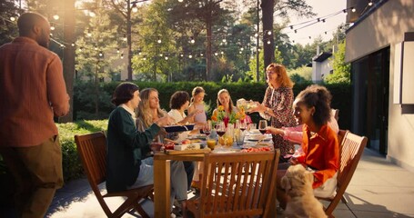 Diverse Men and Women Enjoy a Lively Garden Party at Sunset, Sharing Food and Drinks Outdoors. Man Grilling Meat Nearby while a Golden Retriever Roams Around, Adding to the Festive Atmosphere - Powered by Adobe